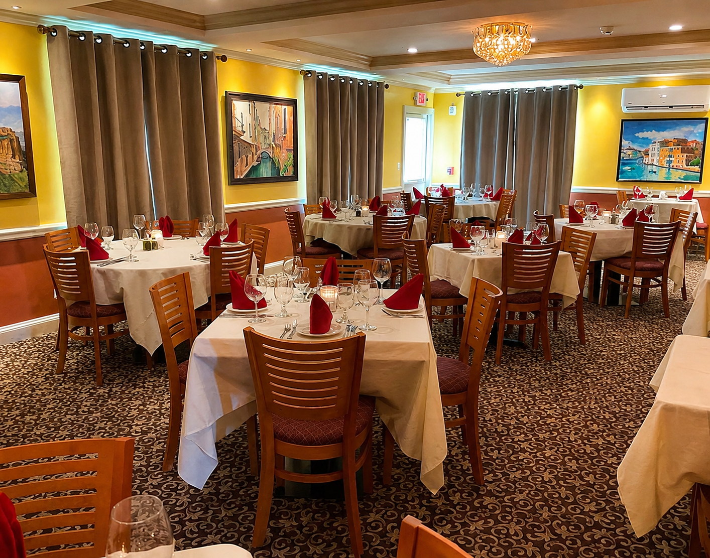 Warm dining room with white tablecloths and red napkins